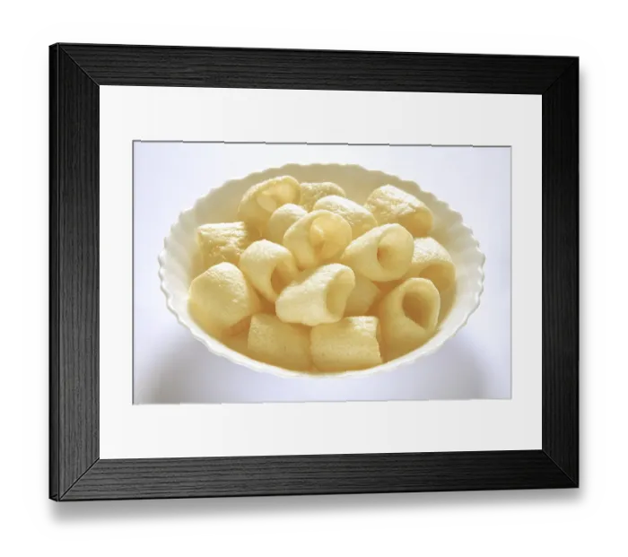 Framed Print : Roasted round chips in bowl on white background