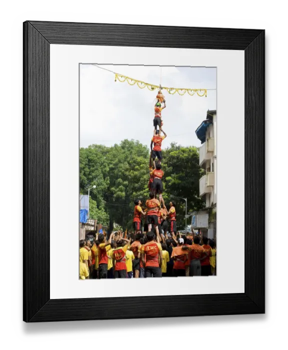 Framed Print : Human pyramid broken dahi handi shower of curd and turmeric water on janmashtami festival at dadar Framed Print : Human pyramid broken dahi handi shower of curd and turmeric water on janmashtami festival at dadar