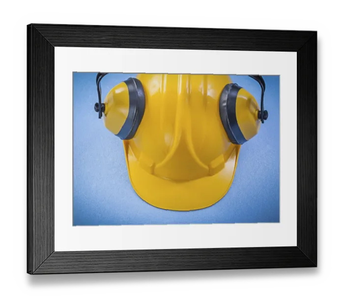 Framed Print : Ear muffs hard hat on blue background construction concept