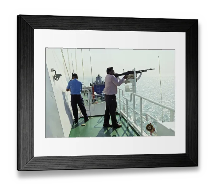 Framed Print : Civilian, tries his hand on locked machine gun