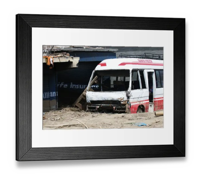 Framed Print : Damaged bus stuck in mud at choglamsar due to flashflood
