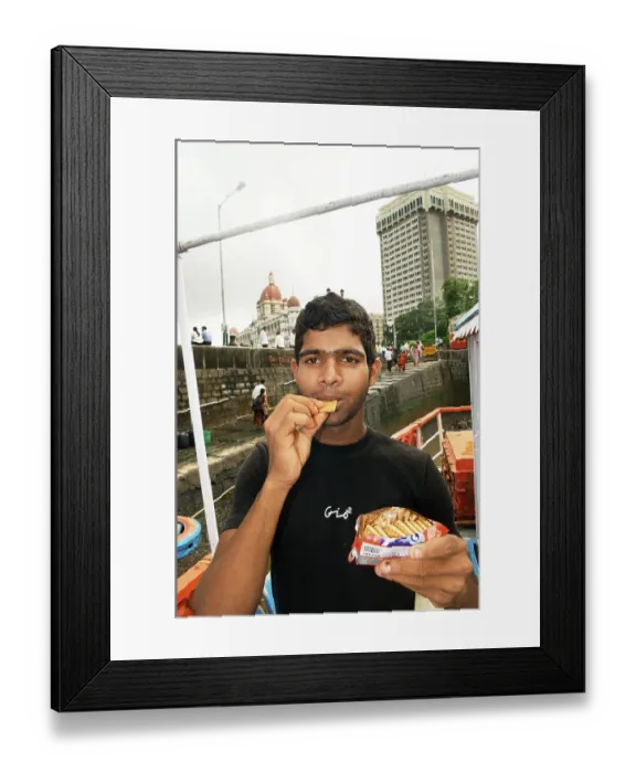 Framed Print : Man eating oil soaked biscuit packets due to container ship chitra colliding in sea Bombay Mumbai