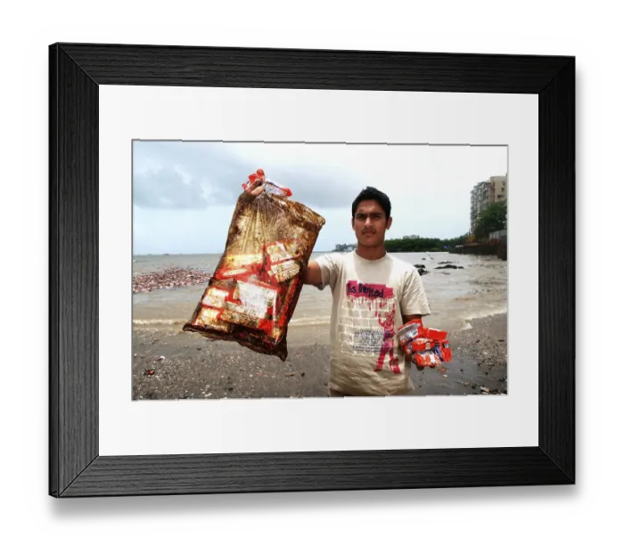 Framed Print : Man showing oil soaked biscuit packets due to container ship chitra colliding in sea Bombay Mumbai