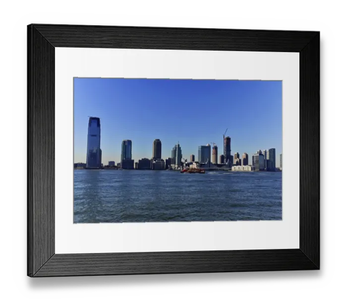 Framed Print : Panoramic view of the skyline of a big city on the water on a clear day