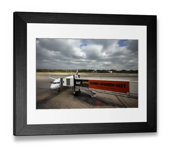 Framed Print : Aircraft Airbus A320 of the airline Eurowings GmbH at passenger boarding bridge or finger Framed Print : Aircraft Airbus A320 of the airline Eurowings GmbH at passenger boarding bridge or finger