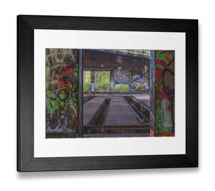 Framed Print : Abandoned hall with graffiti and view of the countryside