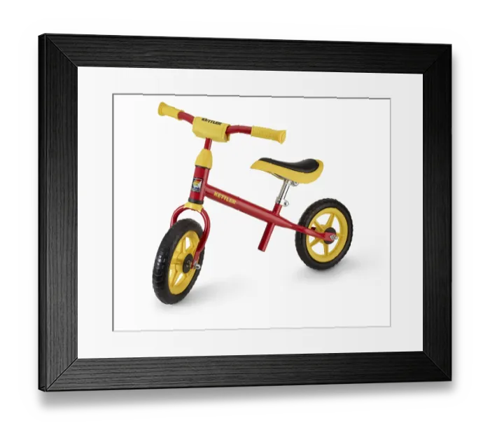 Framed Print : Kettler children's bike in front of a white background