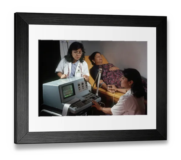 Framed Print : Doctors checking blood pressure of Patient