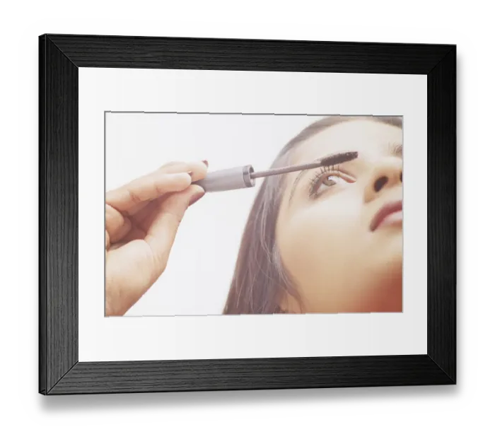 Framed Print : Woman applying Make-up Framed Print : Woman applying Make-up