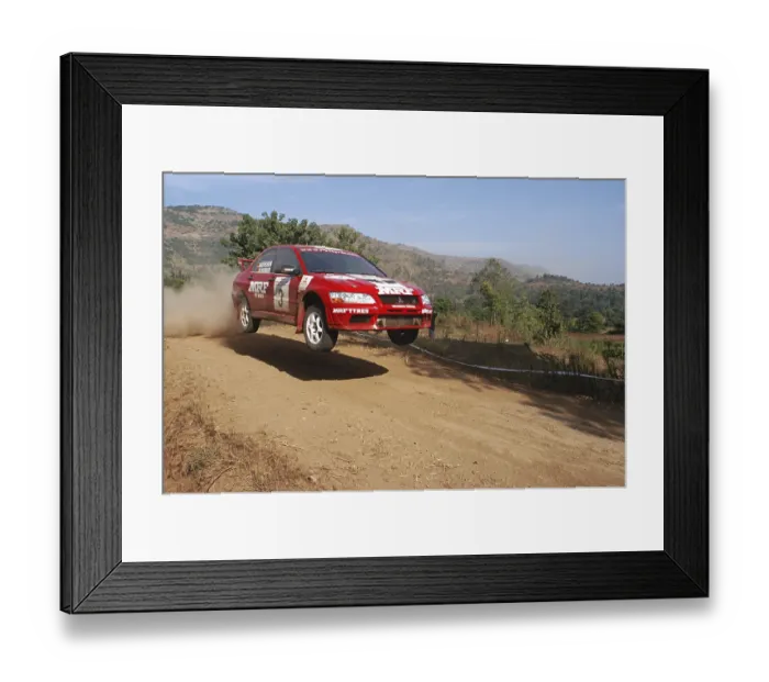 Framed Print : Car no 3, driven by MRF's Armin Kremer & his co-driver Fred Berssen power their way through in the second