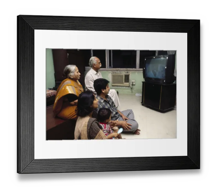 Framed Print : South asian indian family watching television