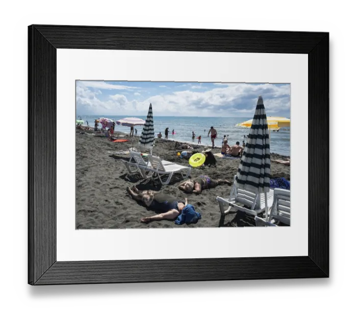 Framed Print : UREKI, GEORGIA - AUGUST 22, 2023: People on the beach with black sand Framed Print : UREKI, GEORGIA - AUGUST 22, 2023: People on the beach with black sand