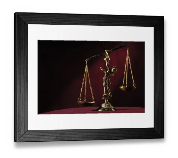 Framed Print : Empty unbalanced brass justice scales isolated on dark red background