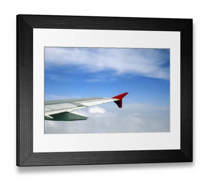 Framed Print : Aerial view of clouds and aircraft wing