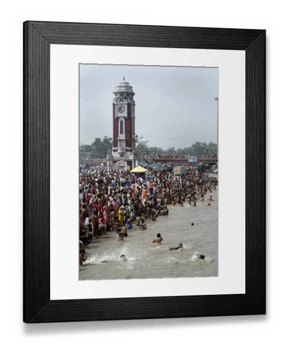 Framed Print : Devotees on riverbank ghats of river ganga ganges taking holy dip at Har ki Pouri in Haridwar