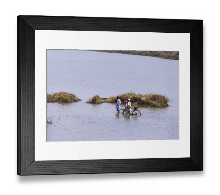 Framed Print : Villager crossing river Indrayani