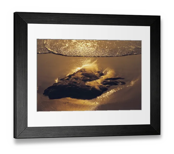 Framed Print : Arriving Wave Reflecting Sun rays at Sunset
