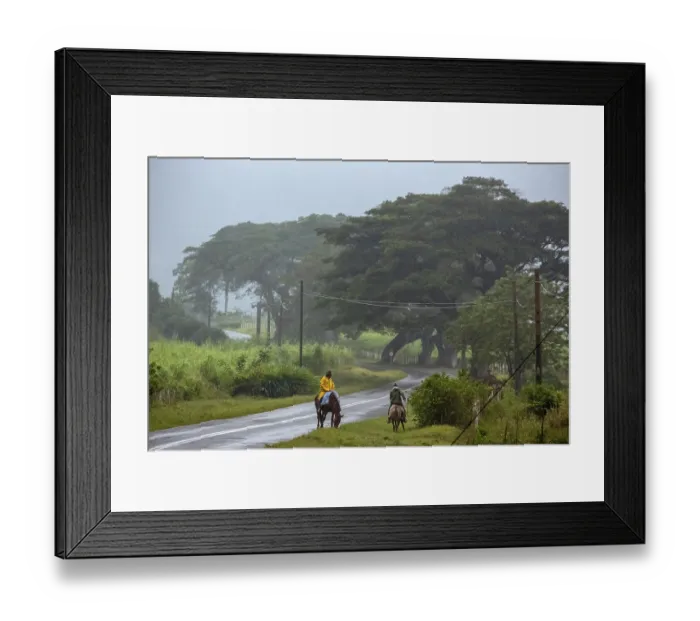 Framed Print : Rider on the rainy country road in Vinales