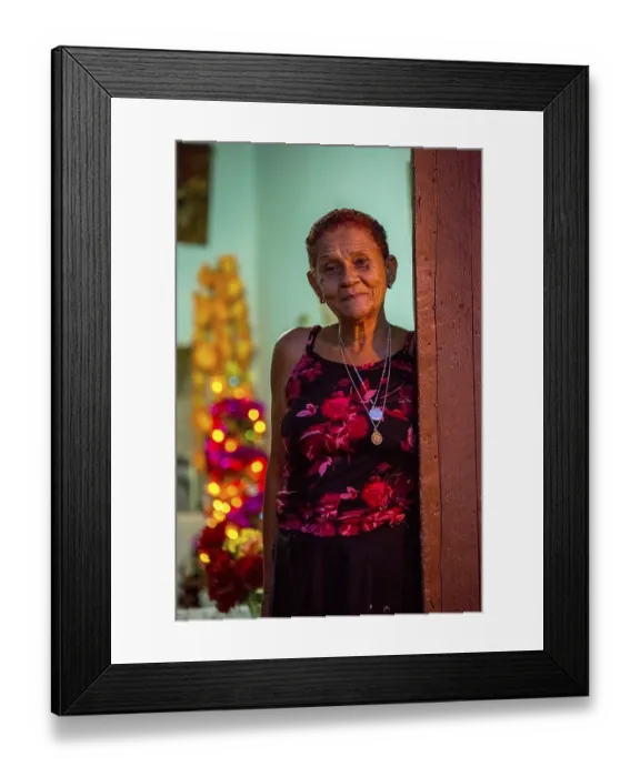 Framed Print : Old lady looks friendly out of her front door