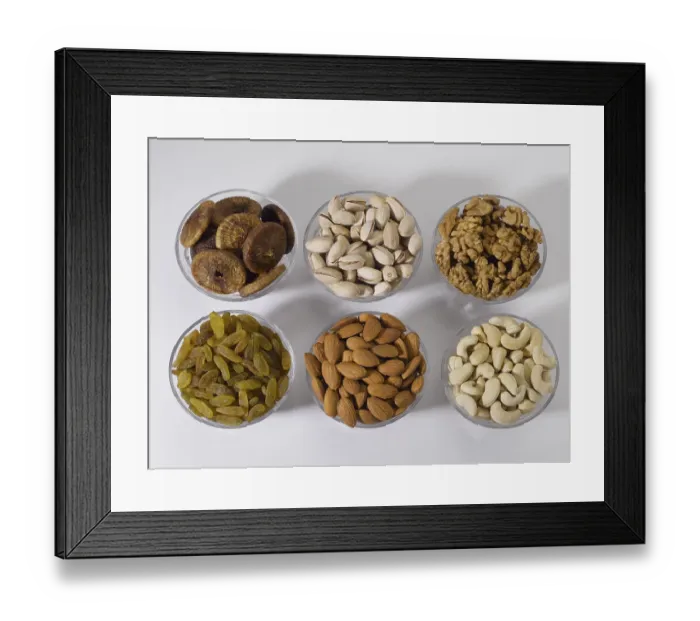 Framed Print : Dry fruits and nuts, almonds pistachios walnuts raisins figs cashew nuts in bowls
