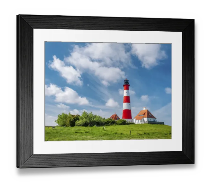 Framed Print : The Westerheversand lighthouse under a blue sky with white clouds