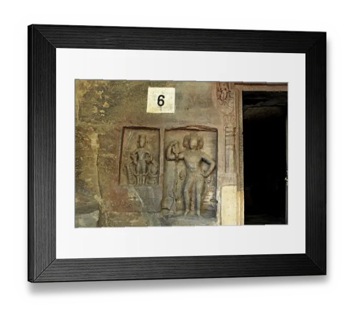 Framed Print : Cave cut into sandstone hill 5 kms from vidish gupta shrines no 6 showing different gods on walls outside door frame