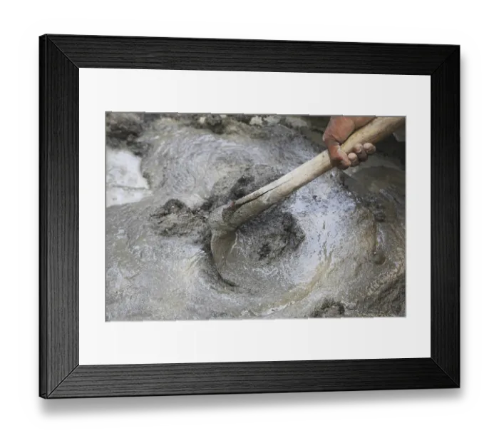 Framed Print : Manually mixing cement sand and water for plaster with help of spade hoe
