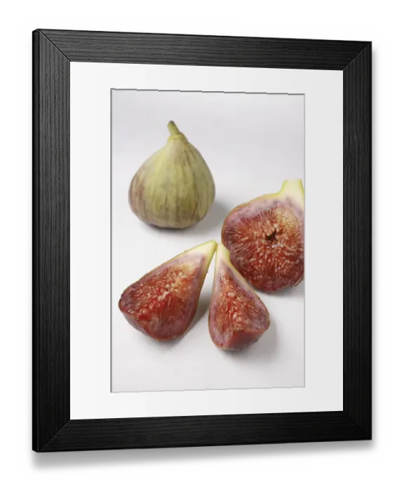 Framed Print : Fruit, one full Fig Ficus Carica Anjir and another cut in three pieces on white background
