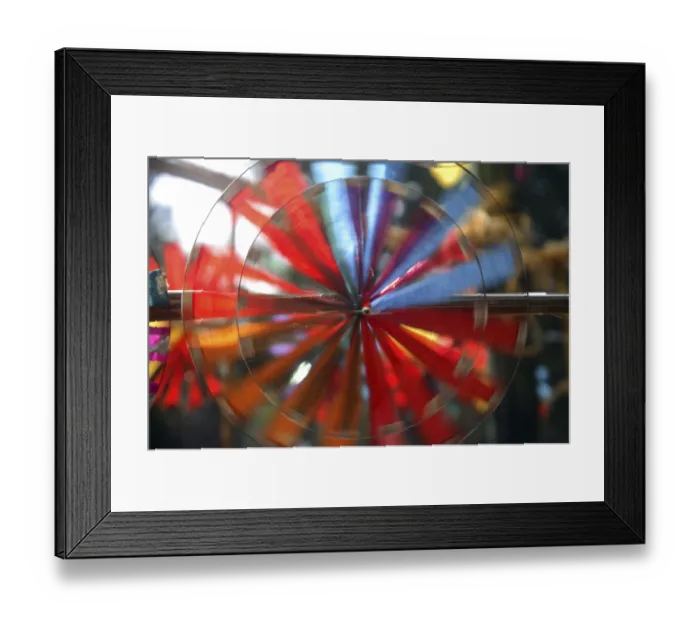 Framed Print : Colorful paper wheels moving by wind