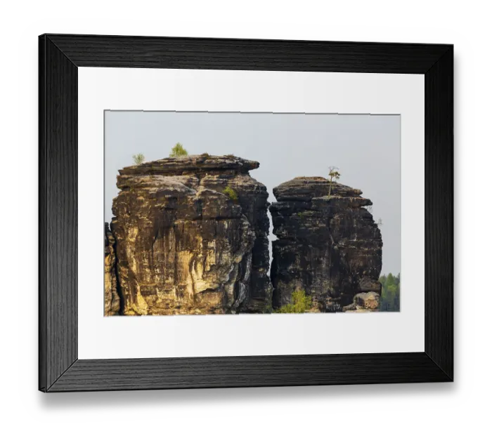 Framed Print : Sandstone formations in late light at the Bastei rocks near the village of Rathen in Saxon Switzerland National Park