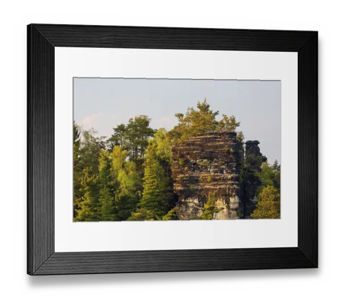 Framed Print : Sandstone formations in late light at the Bastei rocks near the village of Rathen in Saxon Switzerland National Park