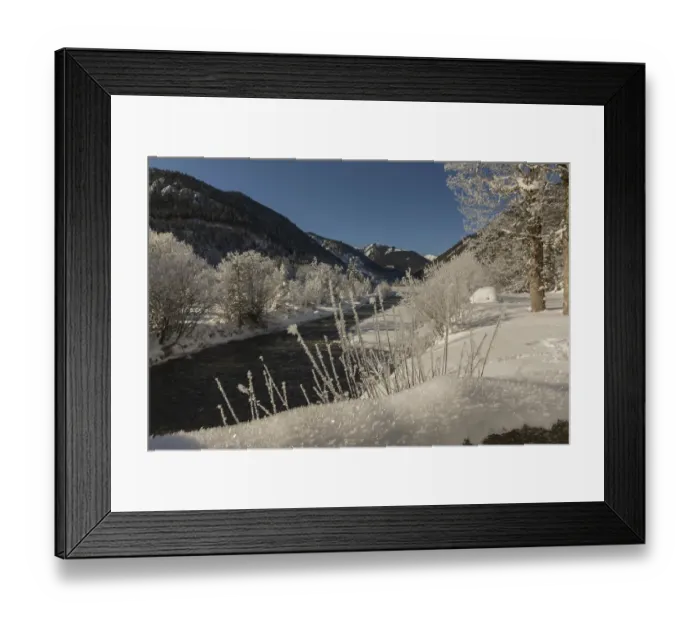 Framed Print : The Riss creek flowing through a snow covered landscape in the Eng valley
