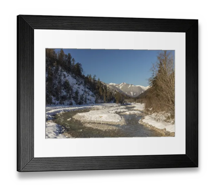 Framed Print : The Riss creek flowing through a snow covered landscape in the Eng valley
