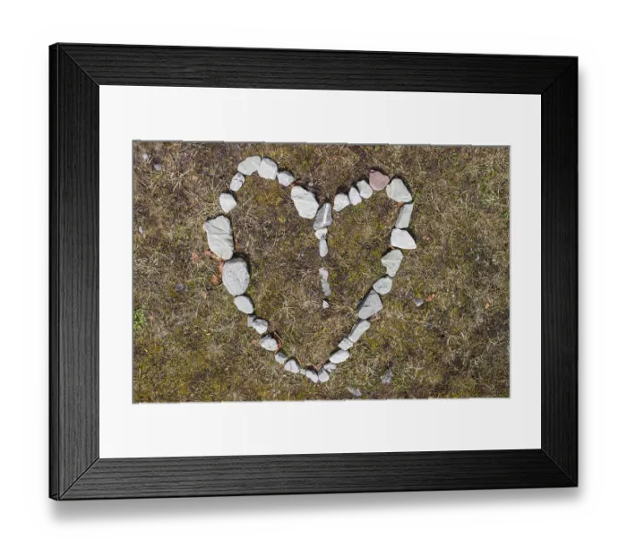Framed Print : Heart of stone. Pebbles arranged as a heart symbol