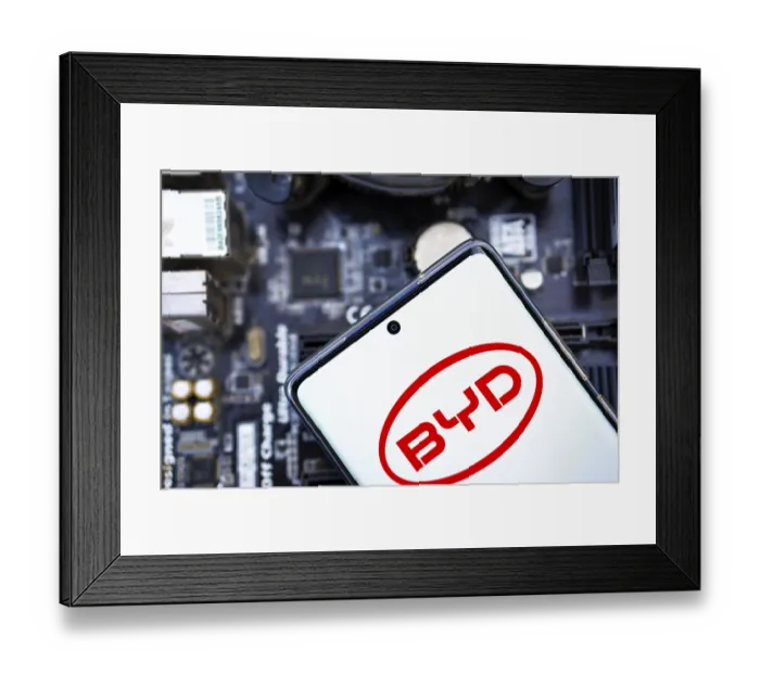 Framed Print : Mobile phone with business logo of Chinese car manufacturer BYD Co