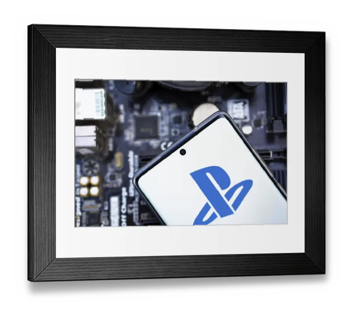 Framed Print : Person holding cellphone with logo of video gaming platform PlayStation Network (PSN) in front of cihp