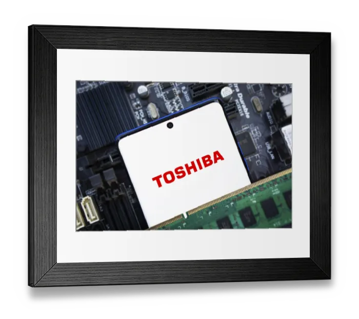 Framed Print : Toshiba logo is displayed on smartphone