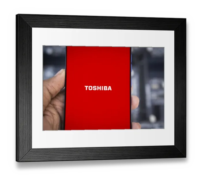 Framed Print : Toshiba logo is displayed on smartphone