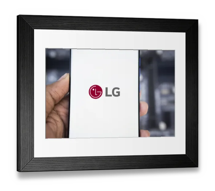 Framed Print : Smartphone with LG Electronics logo on the screen