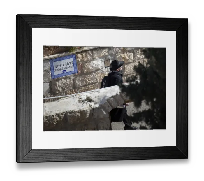 Framed Print : A Jewish man walking past the Chamber of the Holocaust museum in Jerusalem in Israel