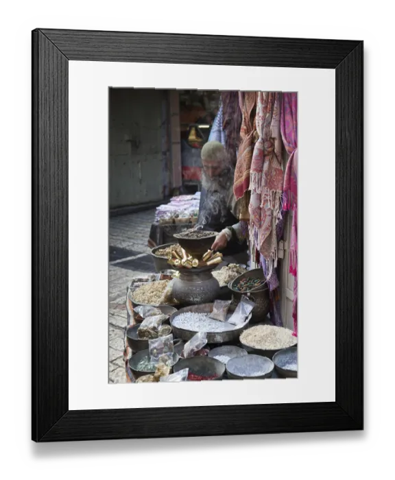 Framed Print : A man selling spices in the ancient city of Jerusalem in Israel