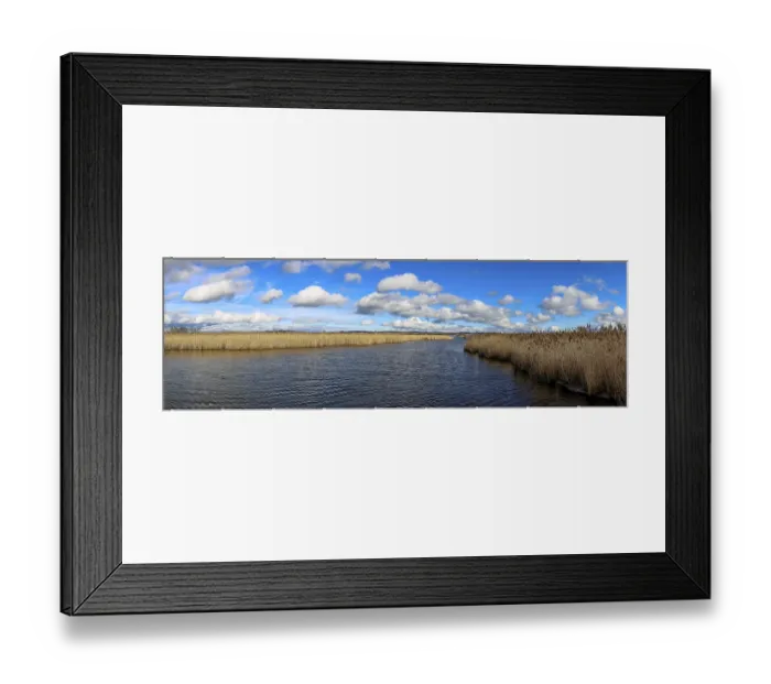 Framed Print : Panoramic photo of Lake Federsee lake with blue sky and white clouds Framed Print : Panoramic photo of Lake Federsee lake with blue sky and white clouds