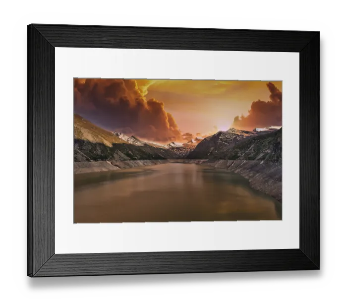 Framed Print : Mountain lake at sunset with dramatic clouds and orange sky