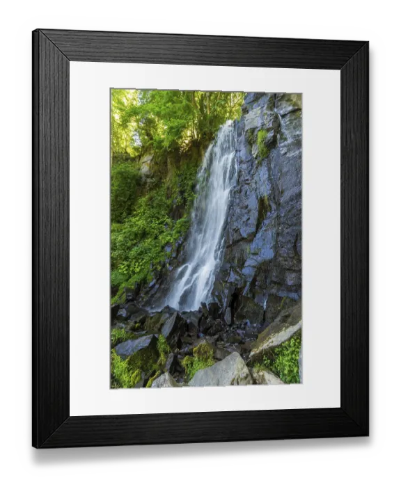 Framed Print : Vaucoux waterfall cascades gracefully over dark rocks