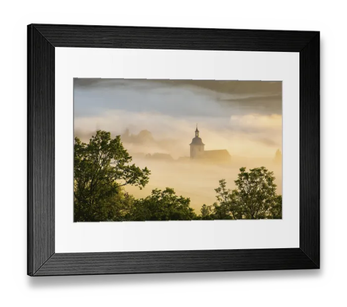 Framed Print : The village church of NiBmitz rises out of the morning mist Framed Print : The village church of NiBmitz rises out of the morning mist