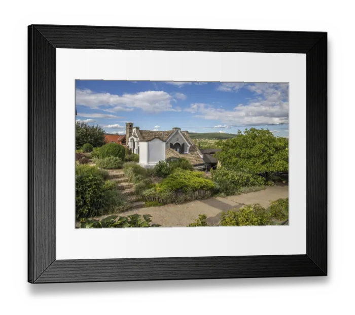 Framed Print : A winery with a blue sky, restaurant and bar in the vineyards of Heviz Framed Print : A winery with a blue sky, restaurant and bar in the vineyards of Heviz
