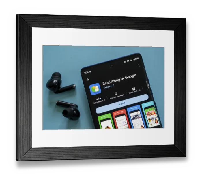 Framed Print : A smartphone displaying the Read Along by Google app ready to install