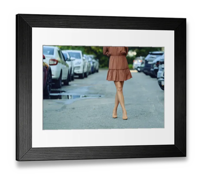 Framed Print : Unrecognizable woman is walking down a city street