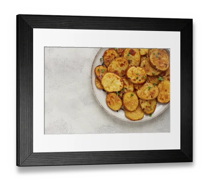 Framed Print : Crispy potato slices, with parmesan cheese and spices Framed Print : Crispy potato slices, with parmesan cheese and spices