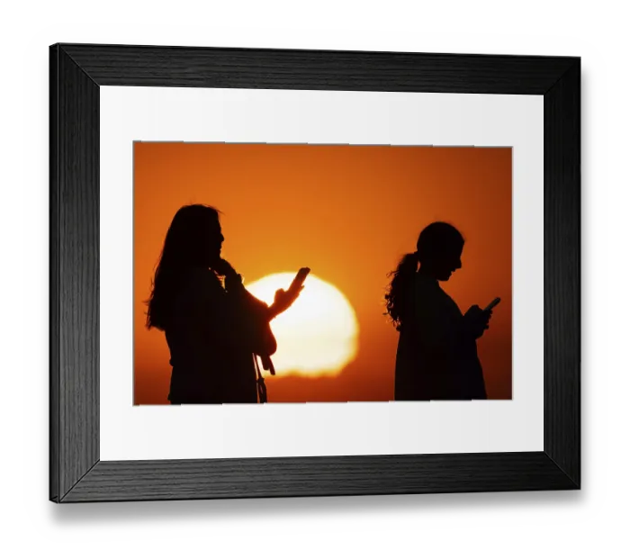 Framed Print : People photographing the sun setting on the horizon with their smartphones from the summit of the GroBer Feldberg Framed Print : People photographing the sun setting on the horizon with their smartphones from the summit of the GroBer Feldberg